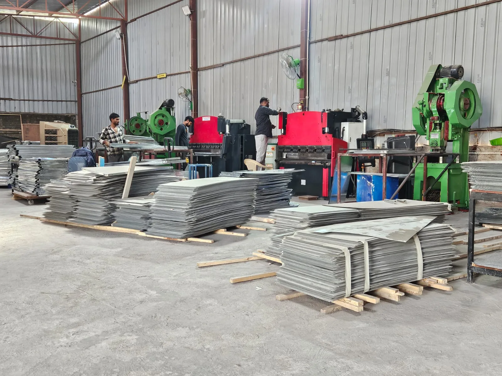 Sheet-metal fabrication floor with equipment and stacked panels