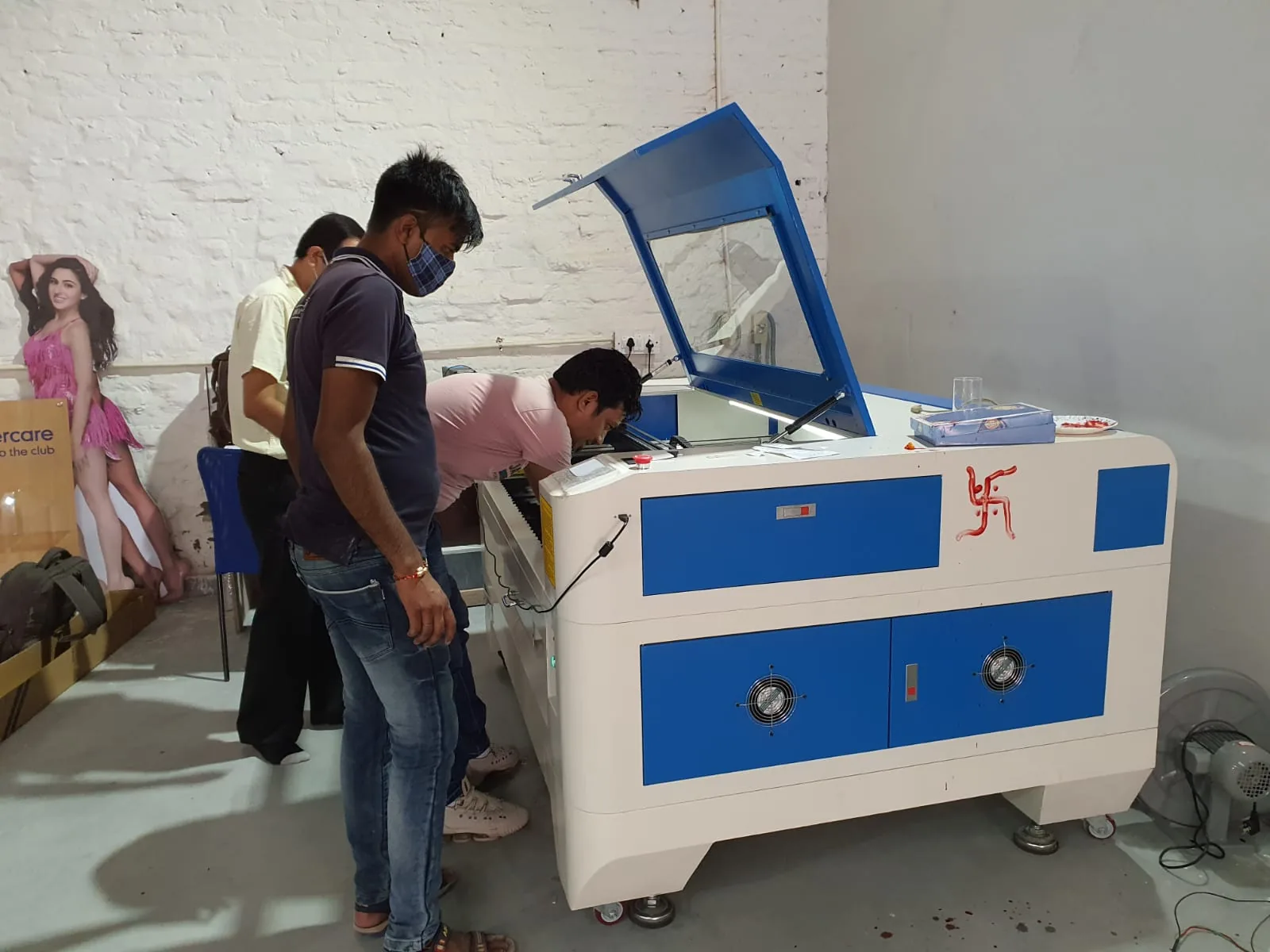 VM Live production team at a cutting machine